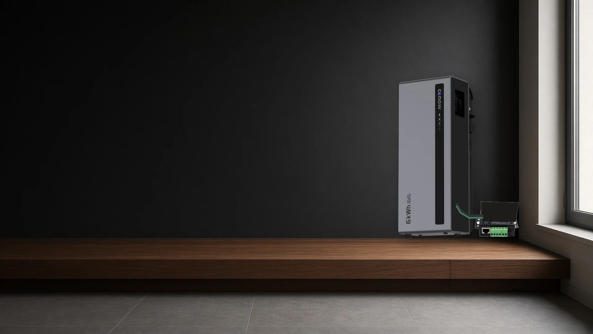 Conow home battery standing on a dark walnut shelf next to a Home Assistant control gateway, softly lit against a charcoal wall